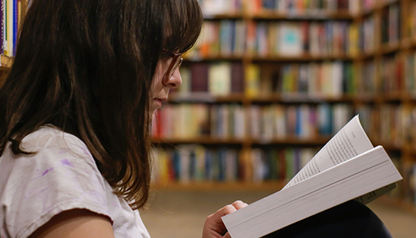 Woman reading in a library